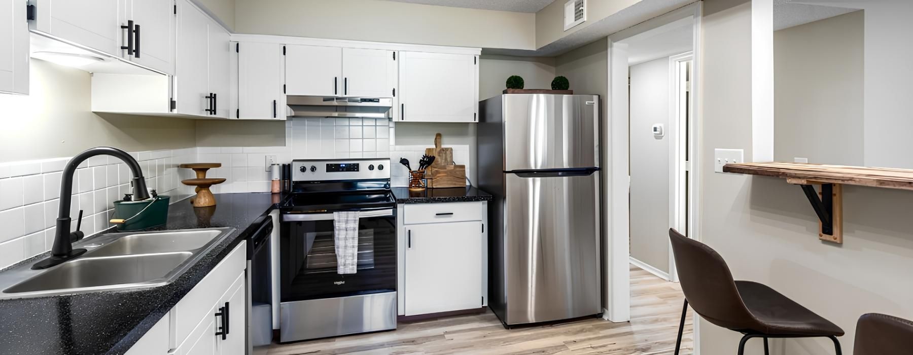 a kitchen with white cabinets