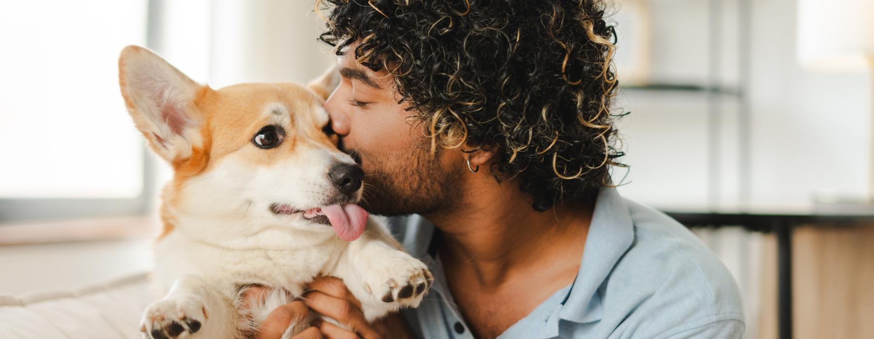 a man holding a dog