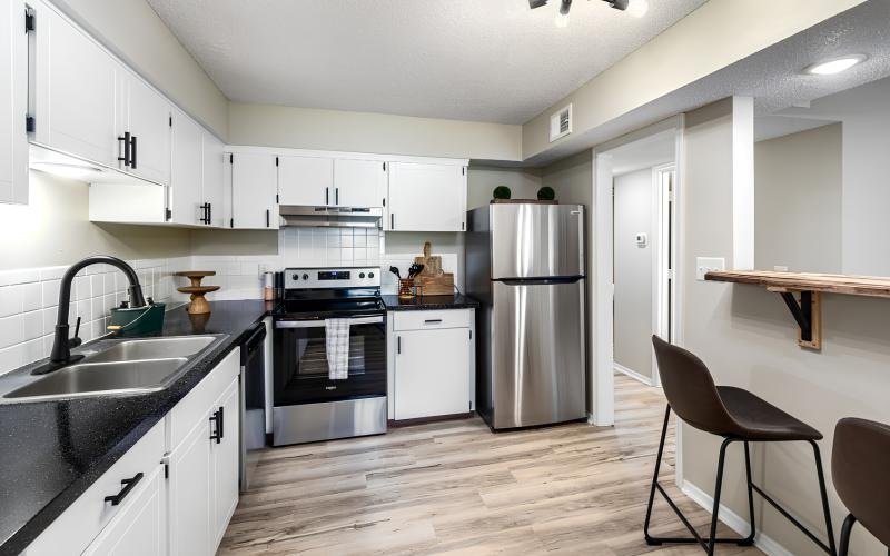 a kitchen with white cabinets